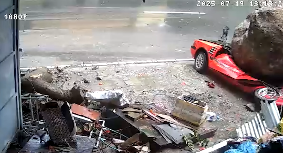 Massive Boulder Flies Into Driveway in Philippines almost squashing this lucky dog